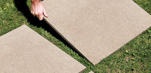 laying outdoor flooring on grass